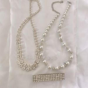 2 diamond and imitation pearl necklace and a bracelet